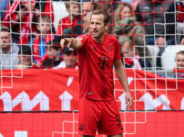 "Harry Kane in Bayern Munich kit after receiving suspension before Bundesliga title match."